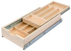 an open drawer with two drawers on each side and the bottom section opened to show what's inside