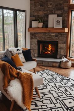 a living room filled with furniture and a fire place in the middle of the room