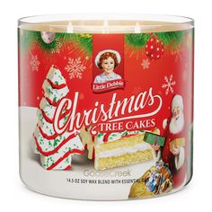 a christmas tree cake candle in a tin