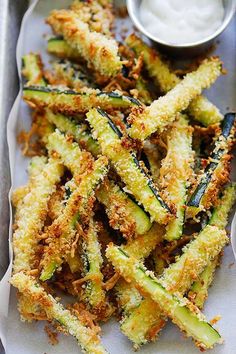 fried zucchini fries on a tray with ranch dressing