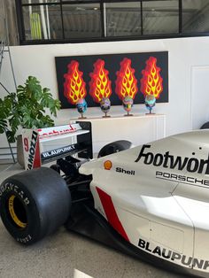 a race car is parked in the garage