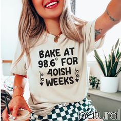 a woman wearing a shirt that says bake at 986 for 40ish weeks