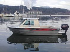 a small boat floating on top of a body of water