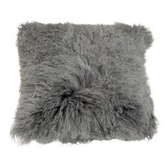 a gray furry pillow on a white background