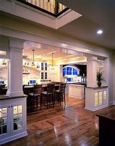 an open kitchen and dining room with hardwood floors