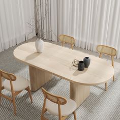 an oval table with four chairs around it and a vase on the top, in front of a curtained window