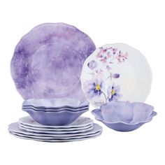 purple and white dishes with flowers on them