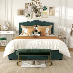 a bedroom with white walls and green headboard on the bed, along with pictures hanging on the wall