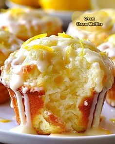 a close up of a muffin on a plate with lemons in the background