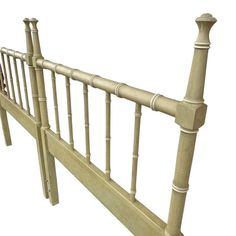 the headboard and foot board of a bed frame with wooden posts on each side