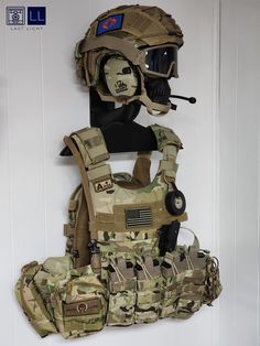 a helmet, vest and goggles are hanging on the wall next to each other