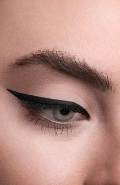 What it is: A thin, soft, waterproof gel eyeliner that offers precision accuracy and ease of application. What it does: No pot, no brush, no cleanup required. Its unique formula is poured into a slim mechanical component and has the malleability, intensity and staying power of a traditional eyeliner. The transfer-proof, long-lasting formula delivers extended wear.How to use: Two clicks is all you need to line the eye. Each advanced mechanical pencil lasts for approximately 17–20 uses. Style Name Elongated Eyeliner, Bad Eyeliner, Cat Eye Eyeliner Tutorial, Tattoos For Women Meaningful, Creative Eyeliner, Eyeliner Guide, Dramatic Eyeliner, Cat Eye Eyeliner, Bold Eyeliner