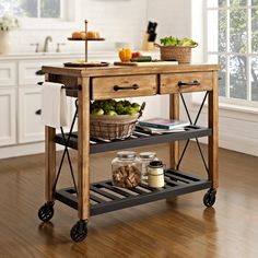 a kitchen island cart with food on it