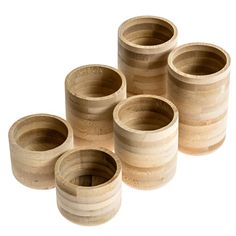 six wooden cups sitting on top of each other