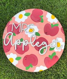 a pink and white sign that says mrs applebyt on it in the grass