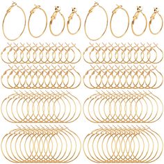 a bunch of gold colored rings on a white background