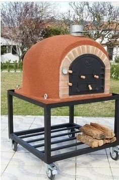 a brick oven sitting on top of a metal cart