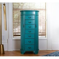 This oval-standing jewelry is a one-of-a-kind piece! Designed with tradition in mind, this stylish armoire also has a modern touch with rounded edges. The jewelry armoire will store your entire jewelry collection with ease; all drawers are lined with anti-tarnish felt. Canora Grey Color: Turquoise | Canora Grey Highfill Oval Free Standing Jewelry Armoire w / Mirror 38.0 H x 16.0 W x 12.5 D in green / blueManufactured Wood in Turquoise | 38" H X 16" W X 12.5" D | Wayfair Turquoise Bedding, Armoire With Mirror, Standing Jewelry Armoire, Oval Jewelry, Mirror Jewelry Armoire, Wayfair Furniture, Pull Out Drawers, Jewelry Armoire, Mirrors Wayfair