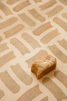 a piece of bread sitting on top of a floor