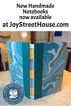 a blue and yellow book with the title new handmade notebooks now available at joystreethouse com