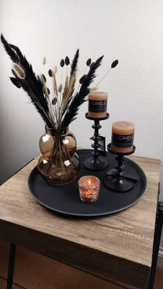 some candles are sitting on a tray