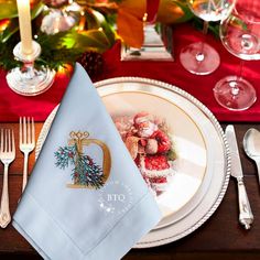 a place setting with silverware and napkins