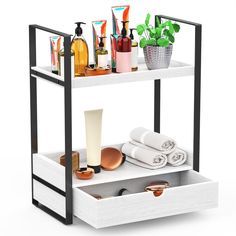 a bathroom shelf with two drawers and various items on it