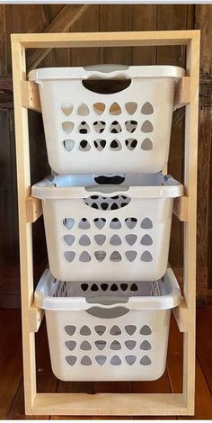 three plastic laundry baskets stacked on top of each other