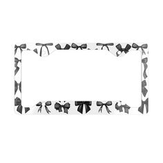 a black and white photo frame with bow decorations on it's edges, in the shape of a rectangle