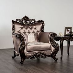 an ornate chair and table in a room