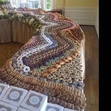 there is a very large bed made out of wine corks and other things on the floor