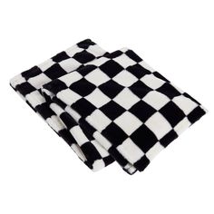 two black and white checkered towels sitting on top of each other