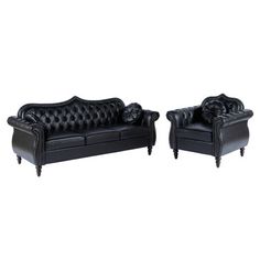 two black leather couches with tufted arms