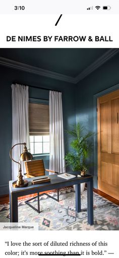 an image of a living room with blue walls and wood trimming on the door