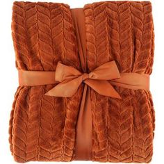 an orange blanket with a bow on it