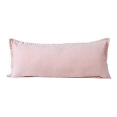 a pink pillow with ruffled edges on a white background