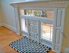 a dog mat is on the floor in front of an open window with doors and windows