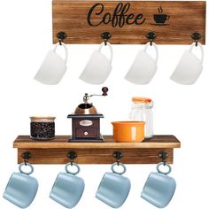 coffee mugs are hanging on the wall above a shelf with cups and saucers