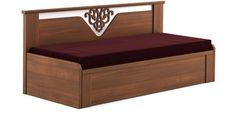 a bed with a wooden headboard and maroon bedspread on top of it