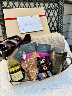 a basket filled with lots of treats on top of a chair