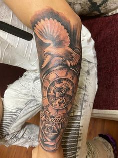 a man's arm with a clock and an eagle on it