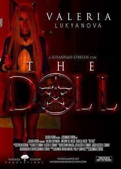 a movie poster for the doll with a woman standing in front of a red background