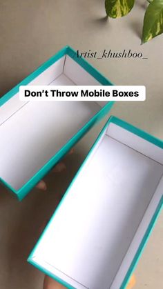 two boxes that have been opened to show the inside and outside of them, one is empty