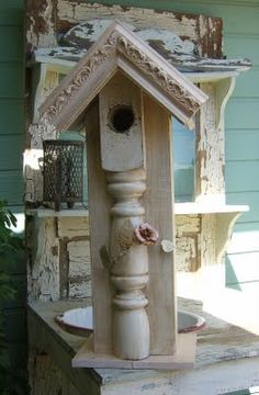 an old bird house is sitting on some steps