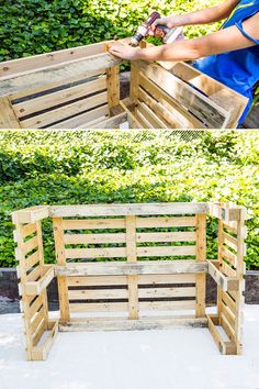 a bench made out of wooden pallets sitting on top of a cement ground next to bushes