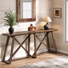 a wooden table with two vases on it and a mirror in the corner behind it