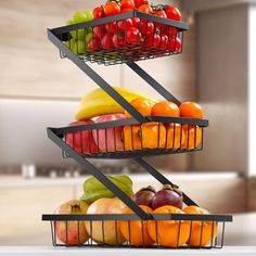 three tiered fruit basket on top of a kitchen counter with fruits and vegetables in it