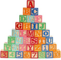 colorful wooden alphabet blocks stacked up in the shape of a christmas tree on white background