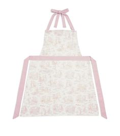 a white apron with pink straps and a bow on the front, it has a light pink