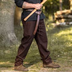 Brown Viking Trousers / Pants - Wool | Medieval Pants Straight cut with an elastic waist band, pockets and a drawstring (which can be easily hidden with a tunic). Can be worn with or without leg wraps. Material: 74% wool, 16% polyester 5% nylon, 3% cotton, 2% viscose.Color: Brown. Sizes: S, M, L, XL, 2XL and 3XL (each are adjustable). Care: We recommend washing with cold water using the delicate/fine wash cycle. Worldwide shipping available!Custom made to order: Please allow up to 1-3 weeks before item ships. Share: Viking Trousers, Medieval Pants, Medieval Shirt, Medieval Tunic, Horns Decor, Leg Wraps, Beard Beads, Bead Hair Accessories, Viking Clothing